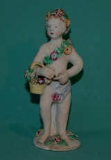 A Bow Porcelain Figure of Putto c.1765