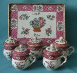 A French Porcelain Set of Five Custard Cups, Covers and Tray